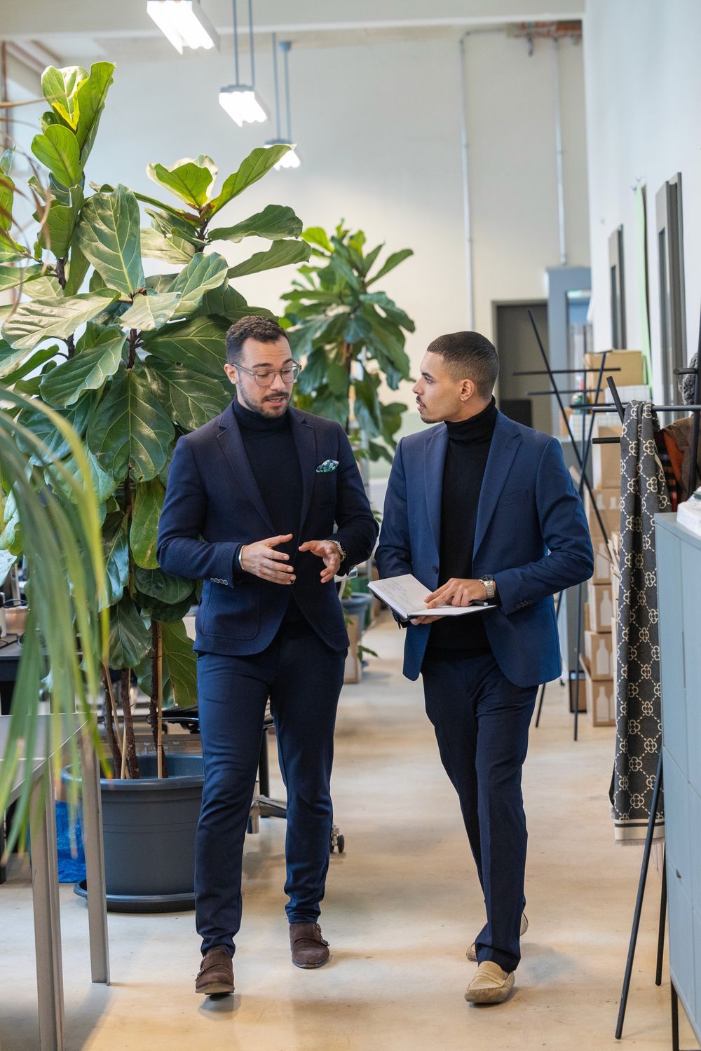 Two consultants in conversation in a modern office