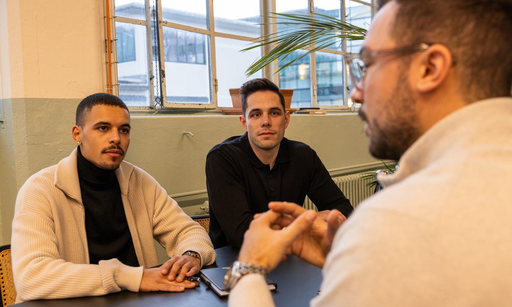 A leadership group in discussion at a meeting table